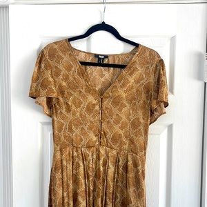 PAIGE silk dress with two slits and a low plunging neckline. Super sexy.